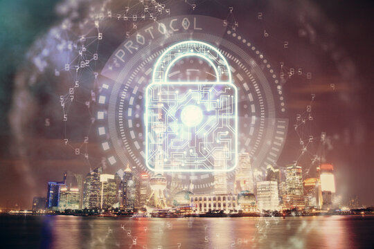 Lock icon hologram on city view with skyscrapers background multi exposure. Data security concept.