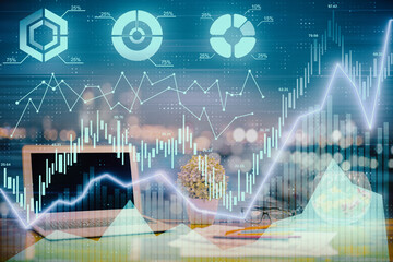 Forex graph hologram on table with computer background. Double exposure. Concept of financial markets.