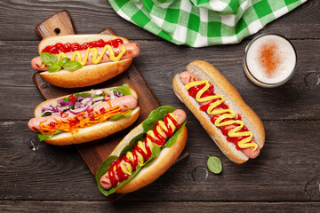 Various hot dog with vegetables, lettuce and condiments