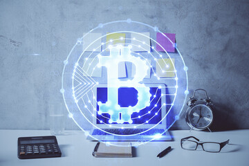 Double exposure of blockchain and crypto economy theme hologram and table with computer background....