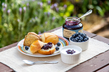 Blueberry jam and scorn with yoghurt