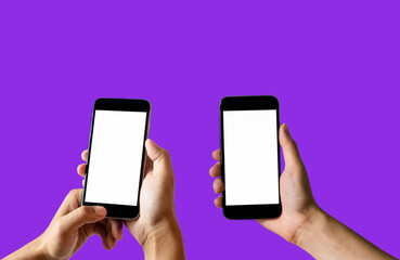 Female hand holding the black smartphone with blank screen and modern frameless design two positions angled and vertical - isolated on purple background.