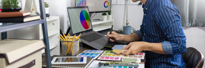 Asian Designer or creative Occupation Design Studio artist working on graphic computer 