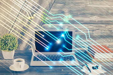 Double exposure of desktop computer and technology theme hologram. Concept of software development.