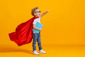 Little superhero studying at school.