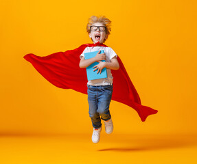 Excited little superhero jumping and screaming during studies.