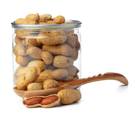 Glass jar with peanuts isolated on white
