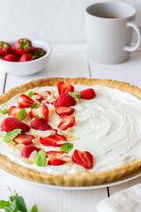 Strawberry cake with mascarpone cheese, almonds and mint. Tart. Cheesecake. Pie. Vegetarian food. Recipe.