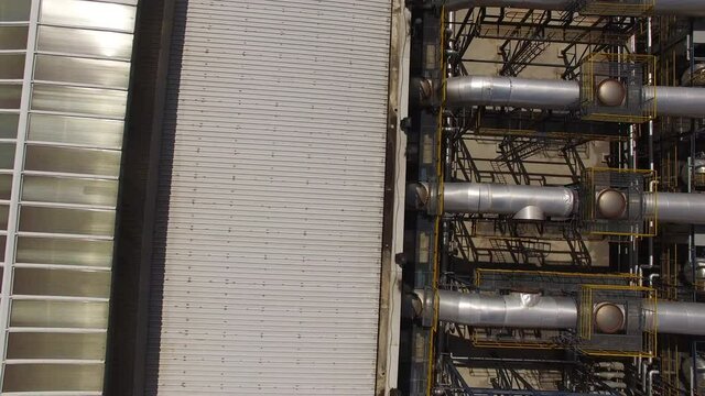 Flying over the roof of a power plant