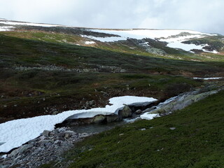 Landscape with snow residue on a background of mountains - Rjukan, Gaustatoppen 