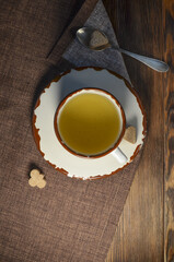 Green tea mug top view, cane brown sugar with space for text. Pleasant tea party in the evening