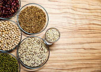 Cereals for proper nutrition on a wooden background, spelled on plates.