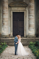 Sunshine portrait of happy bride and groom outdoor in nature location