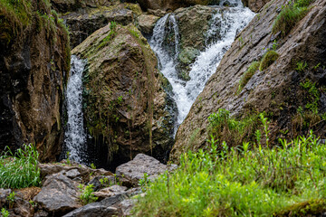 Splashes of the Niagara falls in a sunny day