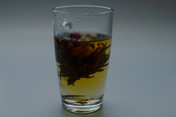 Tea cup with tea leaves.