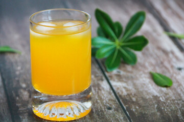 natural cold orange drink in a glass glass