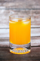 natural cold orange drink in a glass glass