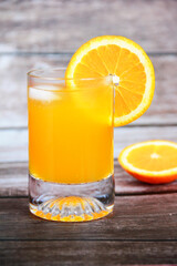 natural cold orange drink in a glass glass