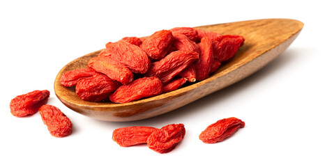 dried Chinese wolfberries in the wooden spoon, isolated on white background