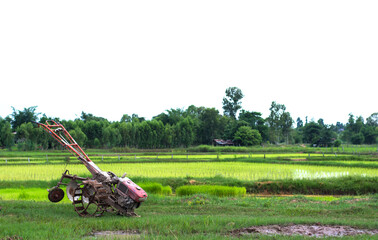 Walking tractor parking at rice field in rainy season,selective focus.