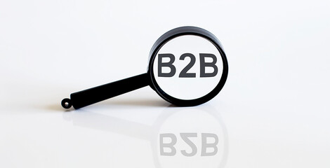 Magnifier with text B2B on the white background