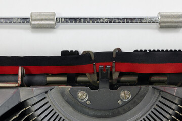 old typewriter with black and red ink ribbon
