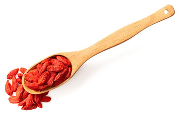 dried Chinese wolfberries in the wooden spoon, isolated on white background, top view