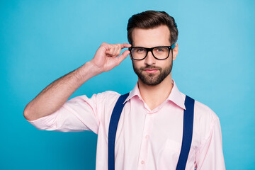 Fototapeta premium Photo of handsome macho business man cool clothes guy smile without teeth eyesight care vision touch specs wear pink shirt suspenders isolated pastel blue color background