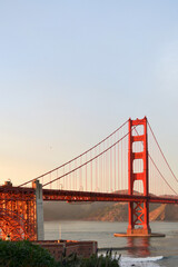 San Francisco 2013, a detail of the Golden Gate bridge, dusk orange light beautiful sky