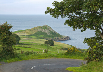 The rocky cliffs of Torr head on the atlantic coast of County Antrim, Northern Ireland, on a sunny...