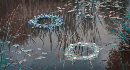 Wreaths of flowers floating on the water