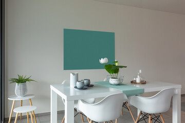 Dining room with white table and white chairs. Modern and linear furniture.