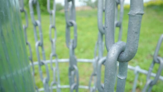 Closer look of the hanging chains of the disc golf