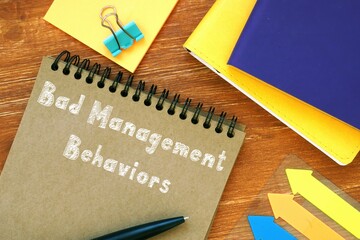 Business concept meaning Bad Management Behaviors with phrase on the piece of paper.