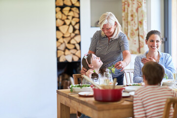 Family with grandmother having lunch