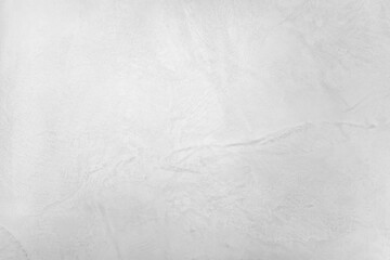 Neutral white colored low contrast Concrete textured background with roughness and irregularities to your concept or product