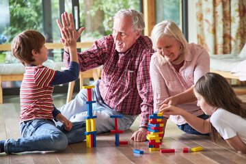 Grandpa and grandchild give themselves a high five