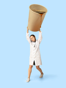 Gas up yourself, filling up with coffee to wake up. Creative artwork. Doctor or nurse holding huge cup with pouring coffee. Looks bored and tired, needs cistern of aroma drink to feel energy.