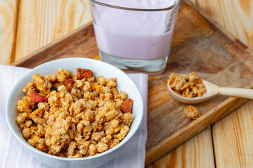 Berry youghurt with granola and fruits in a glass