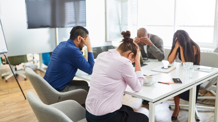 Desperate group of business people in meeting