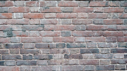
Brick wall of a building. Defocused blurred background for web design.