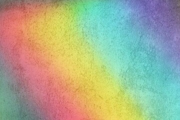 holographic lighting reflected on concrete wall.