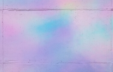 holographic lighting reflected on concrete wall.