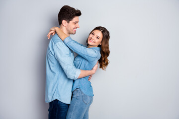 Profile photo lady guy couple in love cuddle hugging together holding hands romantic feelings slow dance wear casual denim shirts outfit isolated grey color background