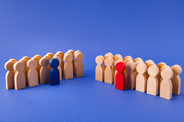 Two groups of wooden figures members participants standing behind their leaders team unity gathering deal agreement isolated over bright vivid shine vibrant blue color background