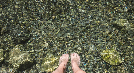 women Feet on in river