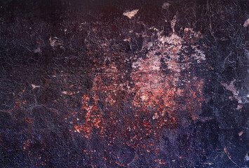 grunge wall background with shelling texture - black and red scratched and cracked surface for a...