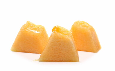 Cantaloupe, muskmelon, honeydew slices, pieces isolated on white background