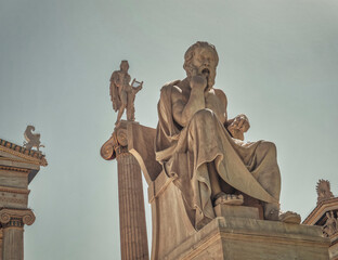 Socrates the philosopher and Apollo god of the arts marble statues, Athens Greece