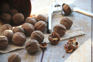 Fresh walnuts on a wooden background